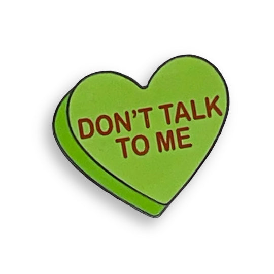 Green heart-shaped pin with the words: Don't Talk To Me.