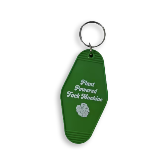 Green vintage motel key tag reads: Plant Powered F U C K Machine and includes a leaf icon in white.
