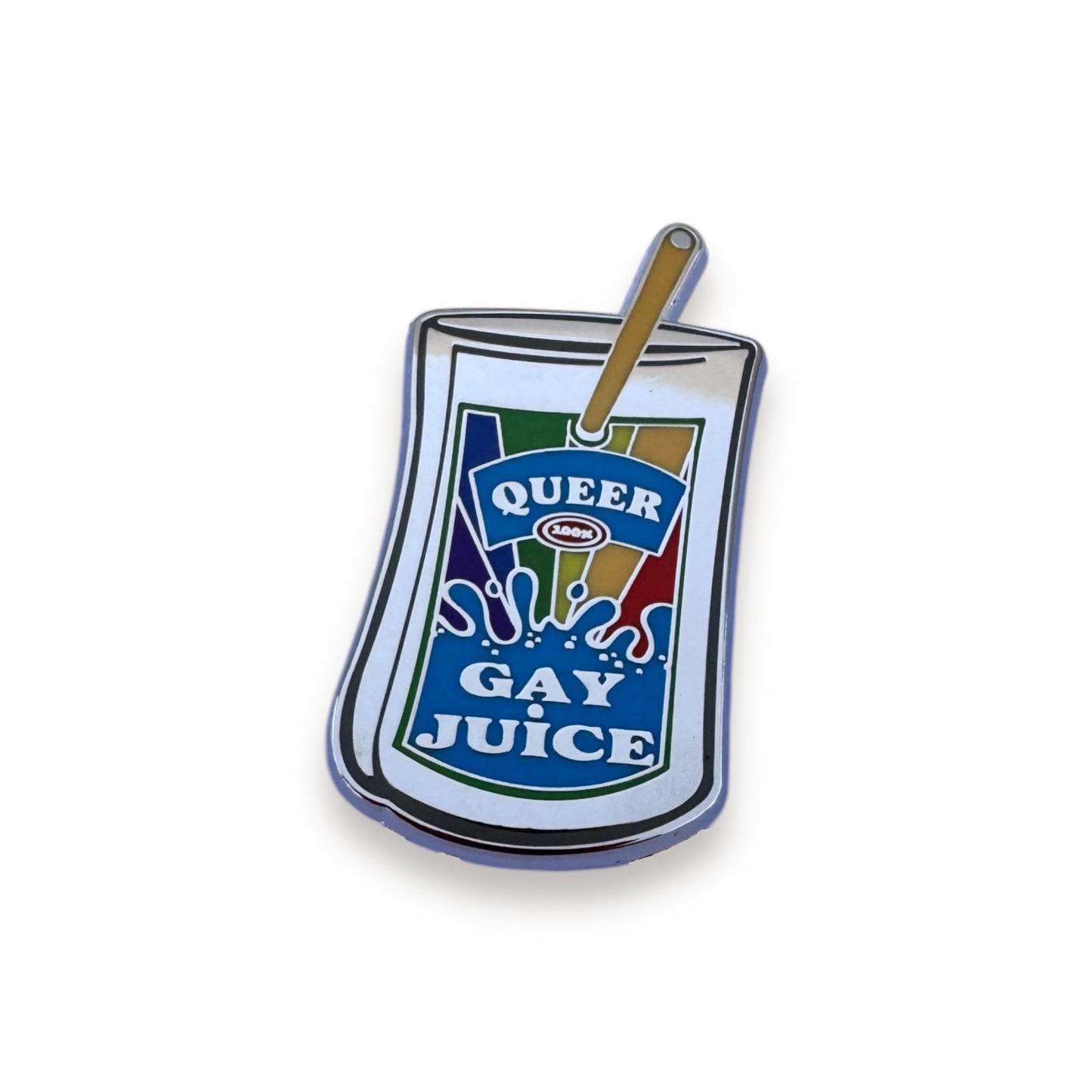 A pin of a juice pouch with a colored label that reads: Queer Gay Juice.