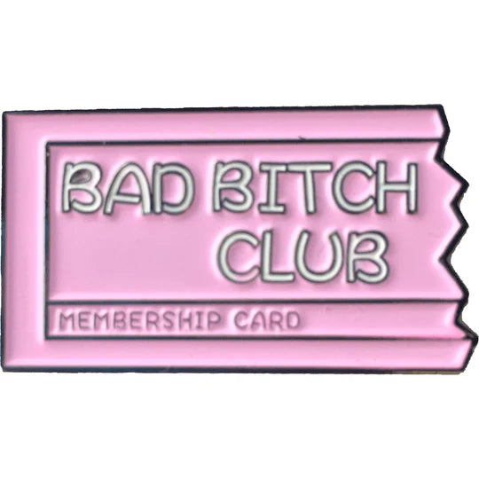 Pink pin of a torn membership card with BAD BITCH CLUB written on it.