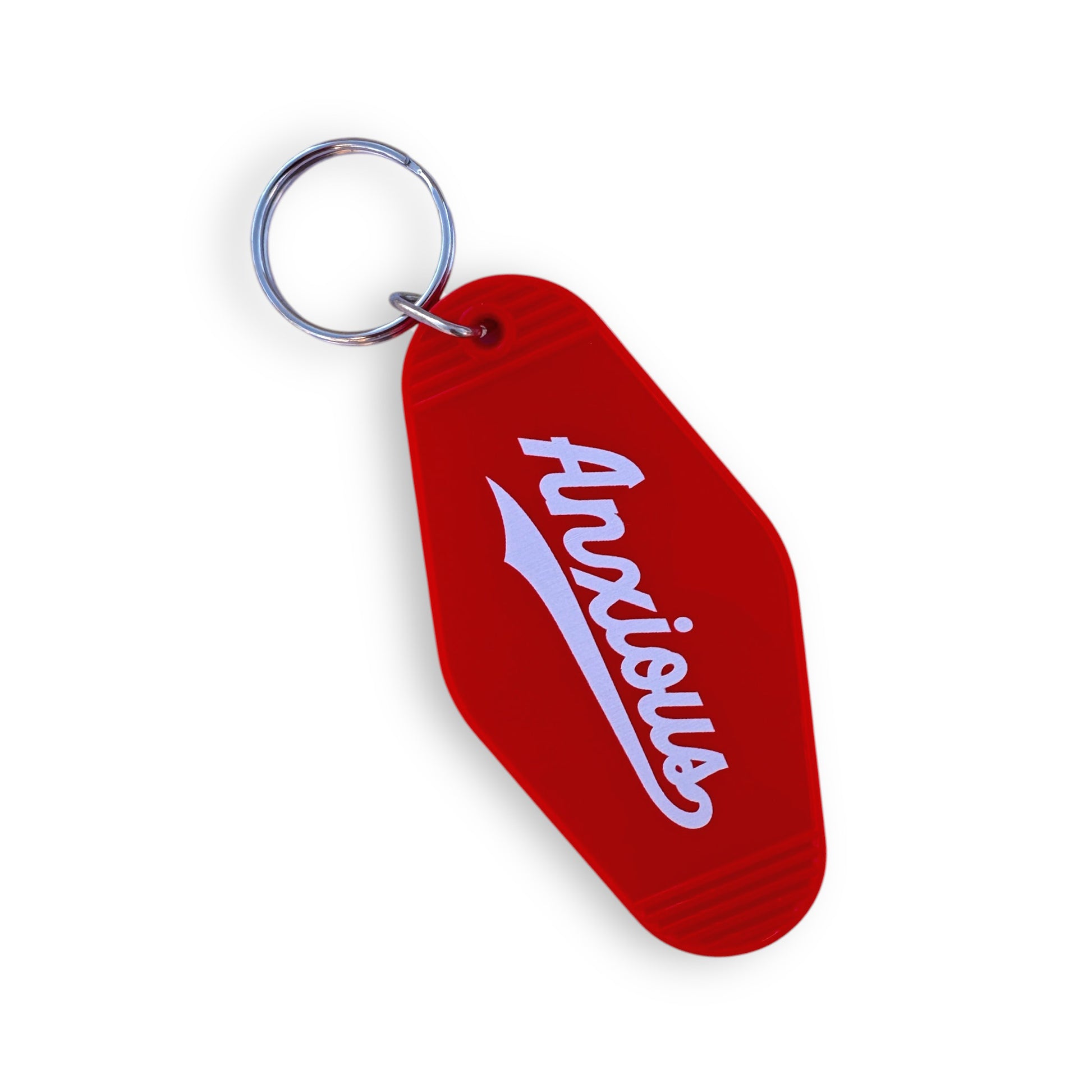 Red vintage-shaped motel keychain with the word, Anxious, written in white.