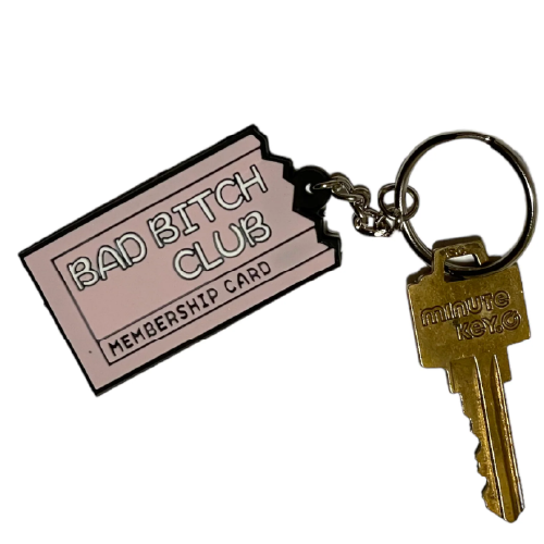 Pink keychain of a torn membership card with the words: BAD BITCH CLUB.