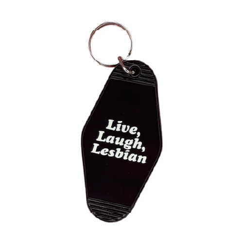 Black vintage-shaped motel keychain with white text: Live, Laugh, Lesbian.