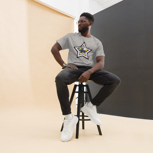 Model in sport grey tee, with pride-colored star with inset cartoon of the Villbergs and The Villbergs Chronicles logo.