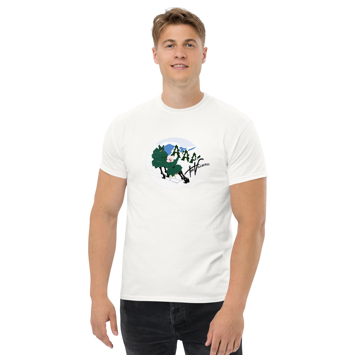 Man in white tee, with cartoon inside a circle of Mr pushing Mrs on a chair-ski down a snowy hill. Includes Villbergs logo.